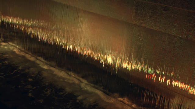 Water cascading down a textured surface