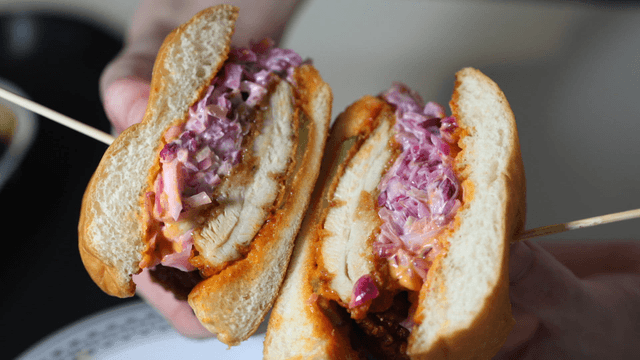 Holding a chicken burger