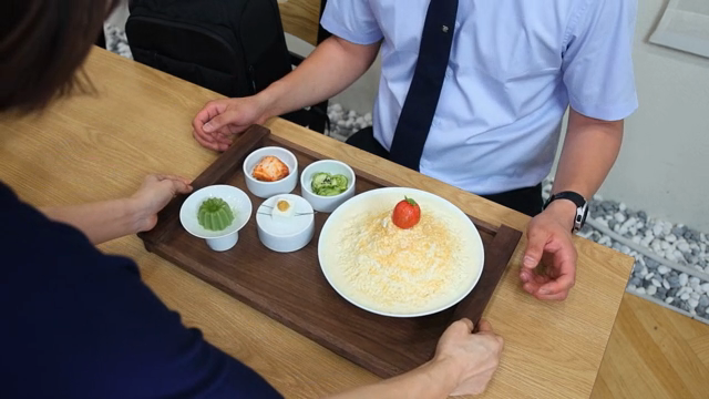 A tray with Korean dishes on a table