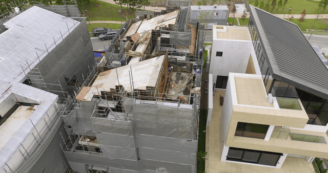 Construction site with workers and materials