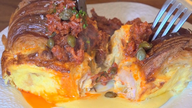 A croissant filled with savory ingredients