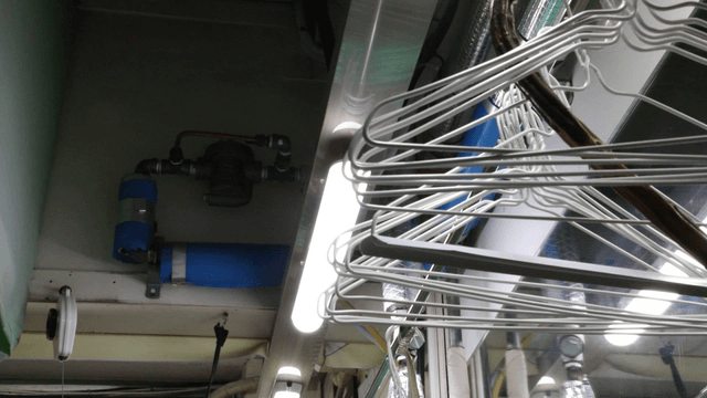 Pipes and hangers in a laundromat
