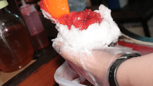 Strawberry syrup on shaved ice dessert