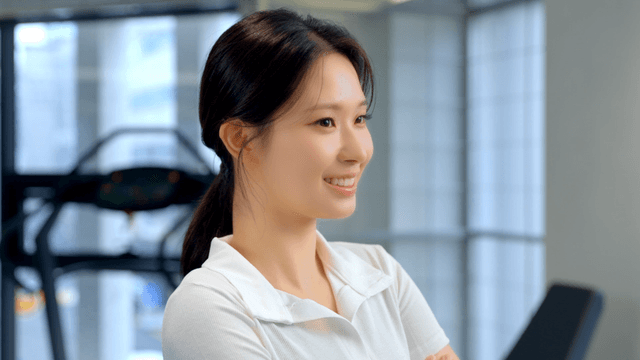 Smiling young woman in a gym