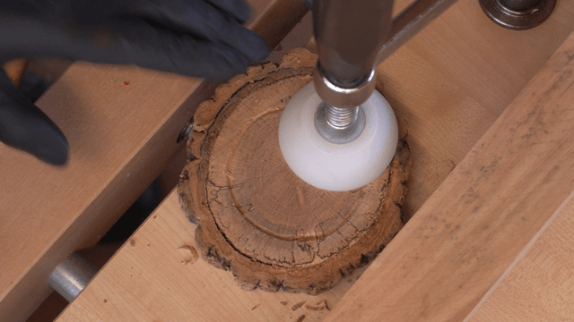 Woodcraft artisan working with chisel and clamp