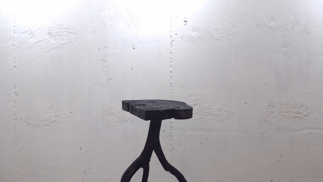 Wooden stool in a minimalist room