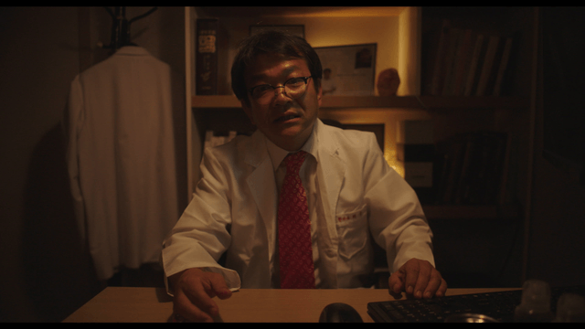 Doctor explaining in dark office