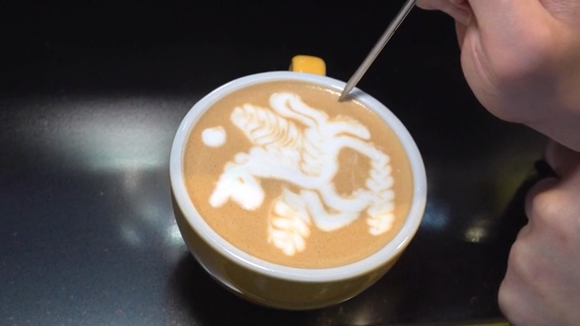 Latte art with a unicorn design in a cup