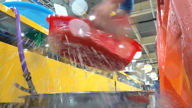 Vendor washing seafood in market environment