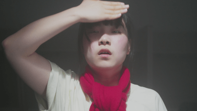 Girl dancing in a dark reading room