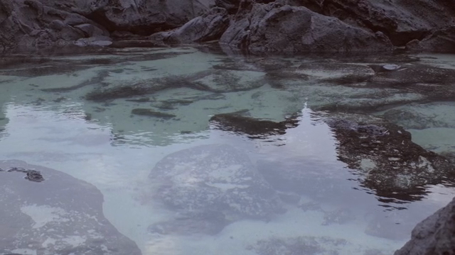Clear water with rocky surroundings