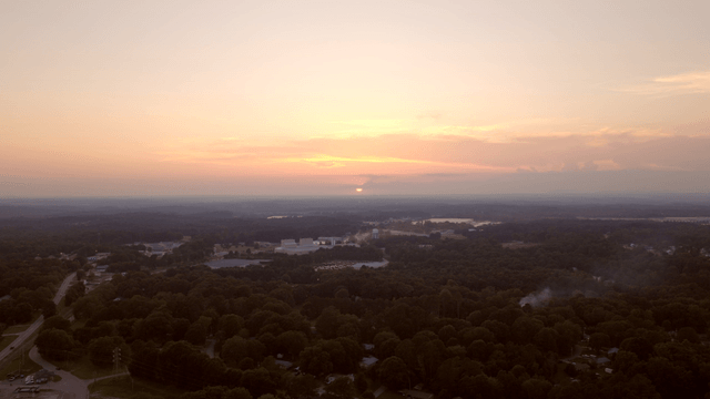 Sunset over a forested landscape