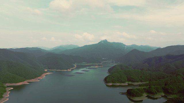 Vast mountain range with a serene lake