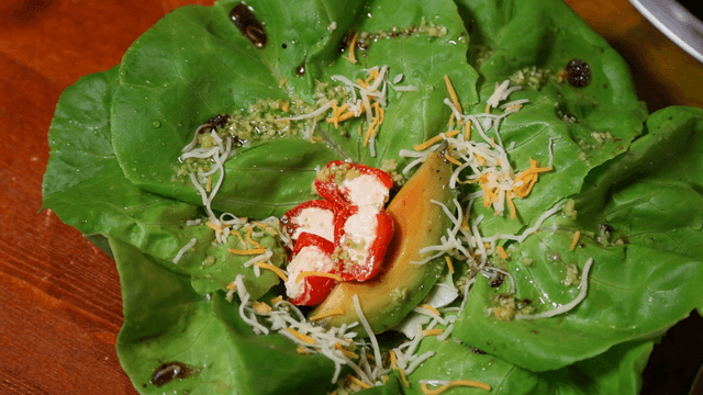 Fresh lettuce salad with cheese and avocado