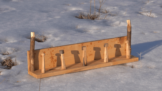 Wooden stand on snow-covered ground