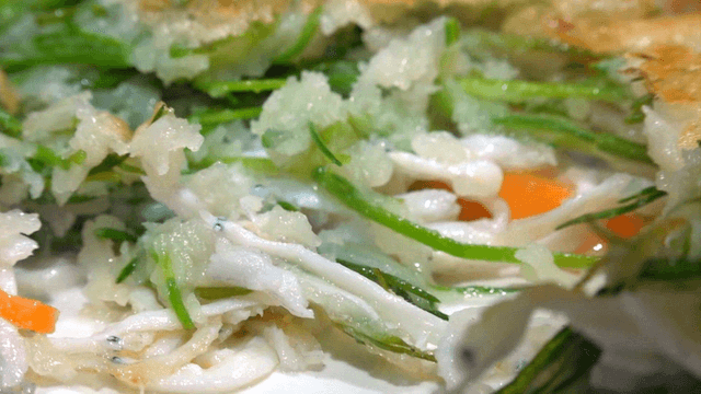 Ice fish pancake filled with glossy vegetables and ice fish