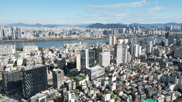 Urban skyline lined with riverside high-rises