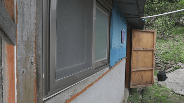 Rustic house with an open door