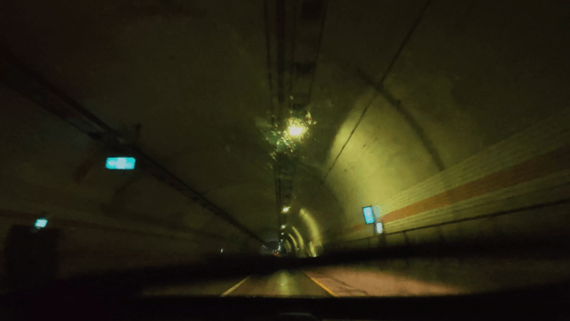 Driving through a tunnel on a rainy night