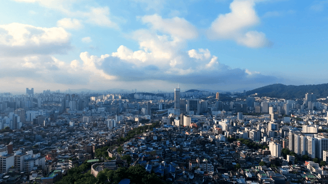 Sprawling cityscape under a blue sky