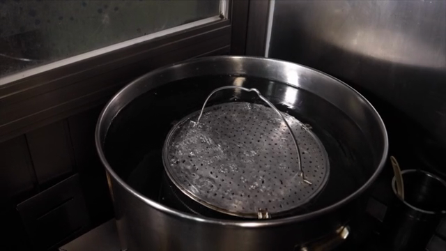 Adding broth ingredients to a pot