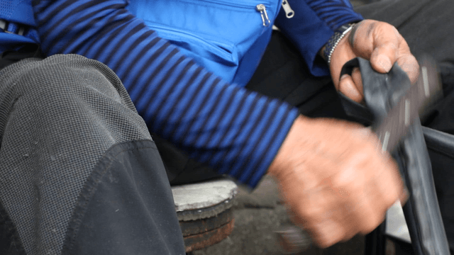 Hands repairing a bicycle tire tube