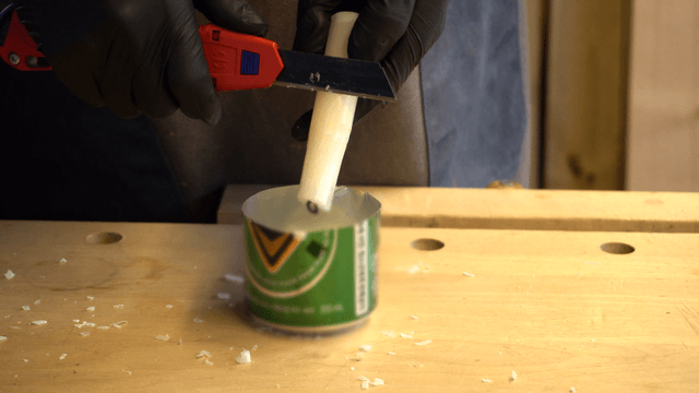 Cutting a candle with a utility knife