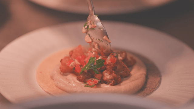 Gourmet dish with various garnishes