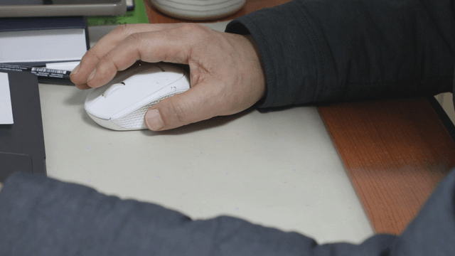 A person using a computer mouse