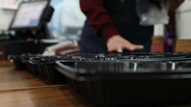 Preparing food trays in a kitchen