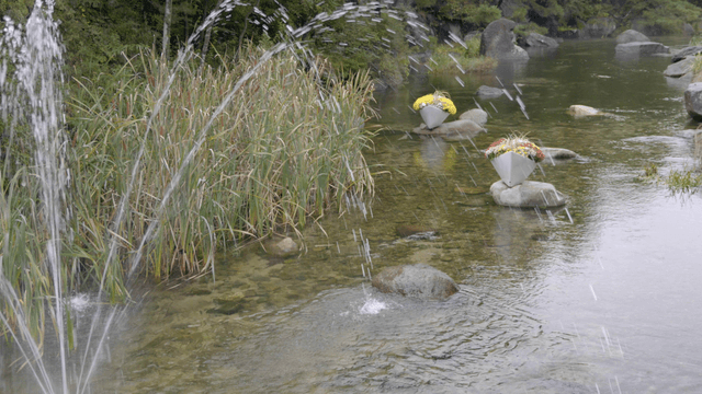 Stream with fountain and floral decoration