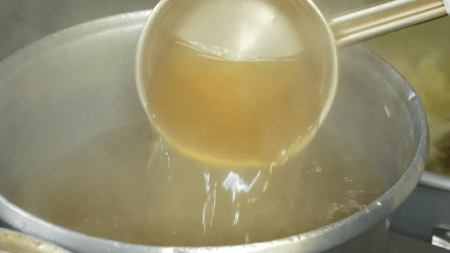 Broth being prepared in a large pot