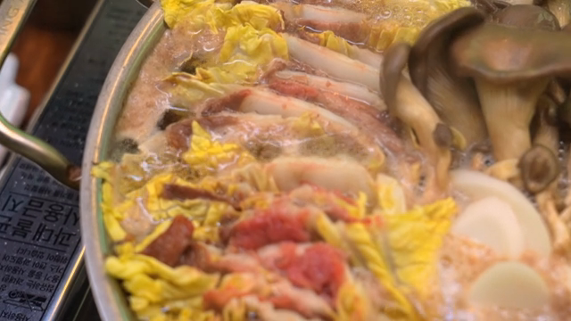 A pot of Korean hot pot with vegetables