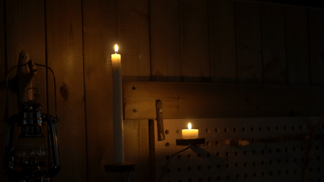 Glowing candles in a dark room