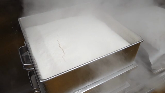 Steamed rice in a metal container