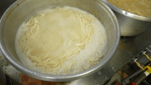 Noodles boiling in a large pot