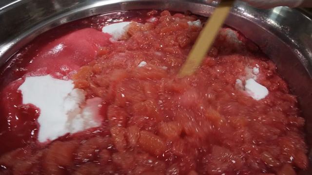 Mixing ingredients in a large metal bowl