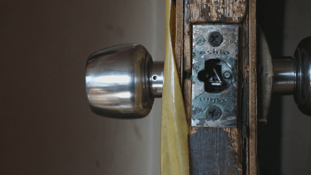 Close-up of a old metal door handle