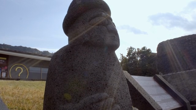 Traditional stone statue in sunlight