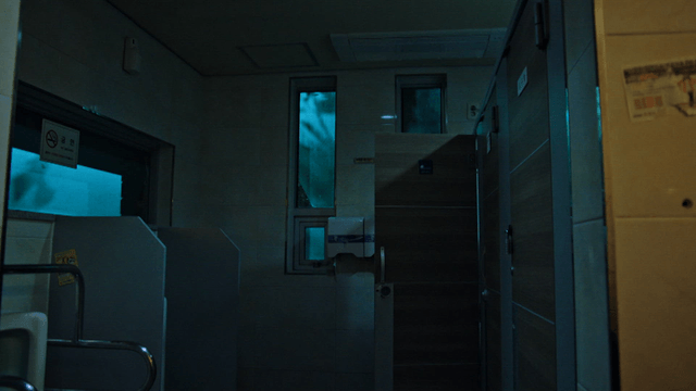 Dimly lit public restroom interior