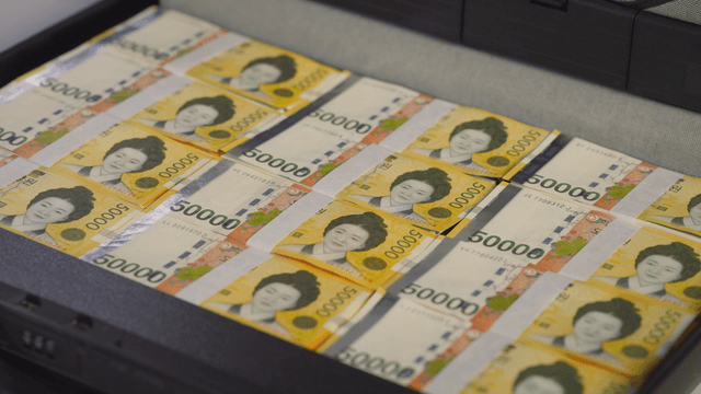 A briefcase filled with stacks of cash