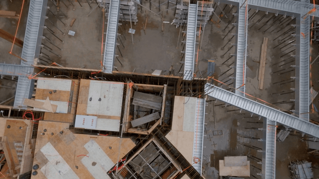 Construction site with scaffolding and beams