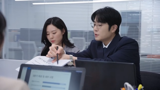 Office meeting with colleagues discussing