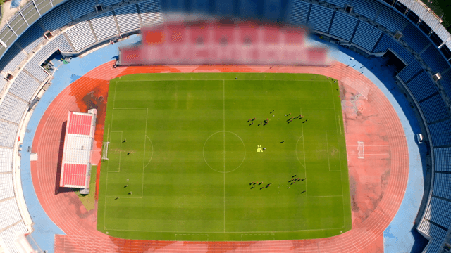 Soccer players training on football field
