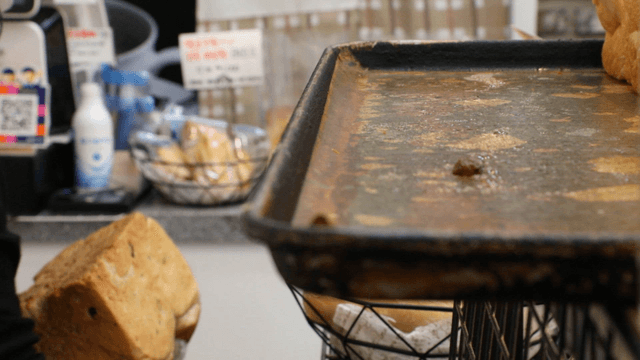 Freshly baked bread being handled