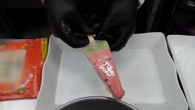 Wrapping watermelon-shaped ice cream in rice paper