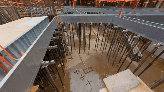 Construction site with metal beams and scaffolding