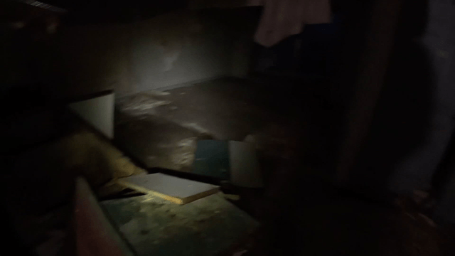 Dark abandoned room with open doors