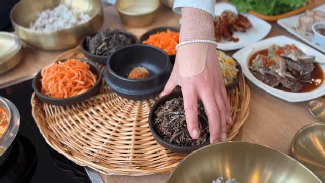 Table set with various Korean side dishes
