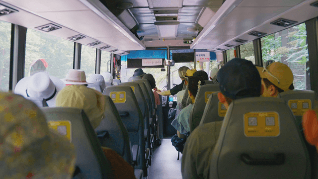 Passengers seated inside a moving bus